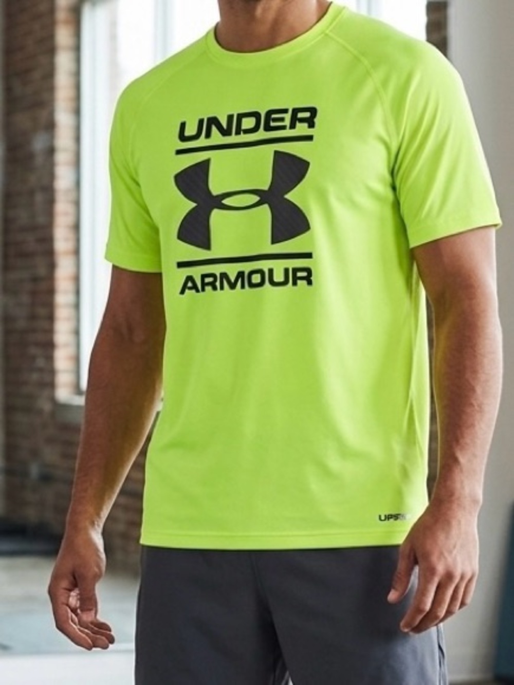 Under Armour Yellow Dri fit T shirt boys youth large with a tiny stain